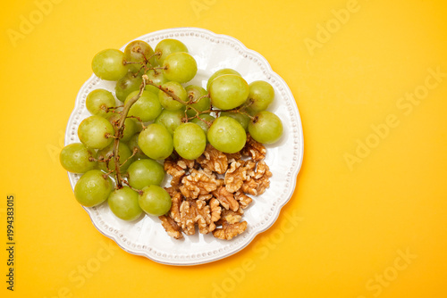 Fresh grapes on a white plate.
