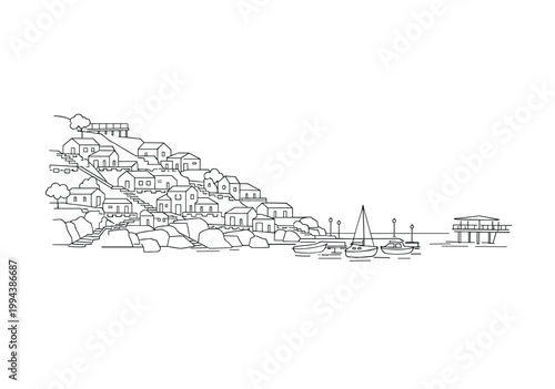 Coastal hillside village with boats and rocky shoreline