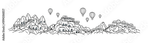 Terraced rock dwellings with multiple hot air balloons above