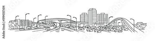 Highway interchange with cars and overpass near city skyline