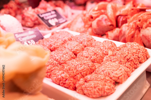 Raw sheep brains on counter of butcher shop