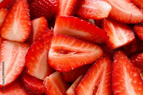 Fresh sliced strawberries, close up view. Strawberry background