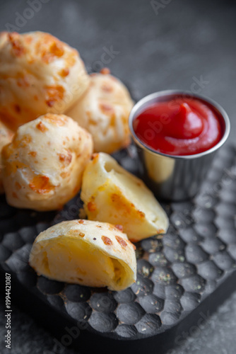 Cheese balls with sauce. Fried cheese.