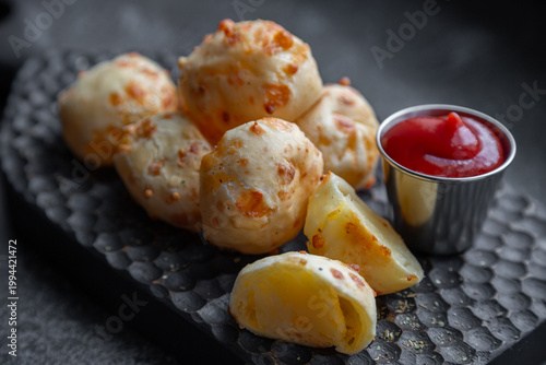 Cheese balls with sauce. Fried cheese.
