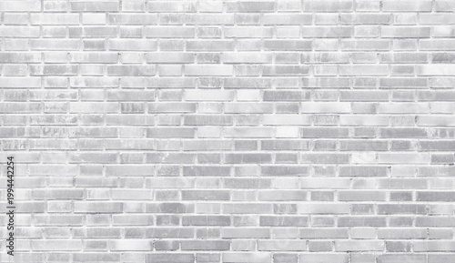 White painted brick wall texture with soft neutral tones and horizontal masonry pattern. Clean architectural background suitable for modern design, interior concepts, mockups and minimal compositions