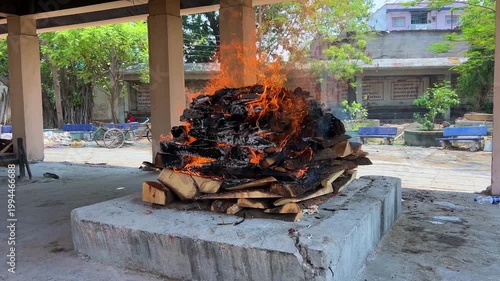 Hindu Cremation Ritual with Burning Pyre at Traditional Cemetery