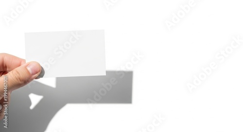 lank business card held by hand against bright white background, vertical mockup for corporate identity, branding presentation or professional contact design