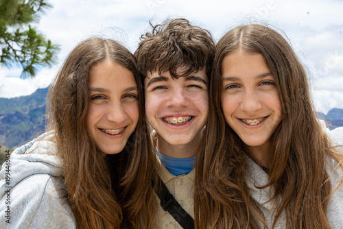 Obraz na płótnie Happy teenage friends smiling at camera close up portrait outdoors