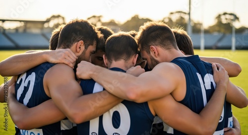 Young Male Athletes in Team Huddle on Sports Field during Training Session