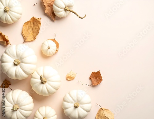 White Pumpkins and Leaves on Table.