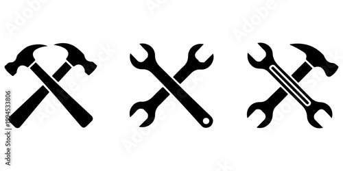 Crossed hammer and wrench tools icon set in silhouette and outline styles representing repair maintenance construction and mechanical service