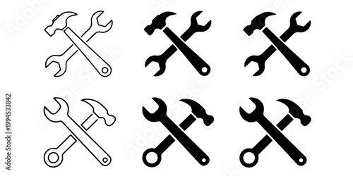 Crossed hammer and wrench tools icon set in silhouette and outline styles representing repair maintenance construction and mechanical service