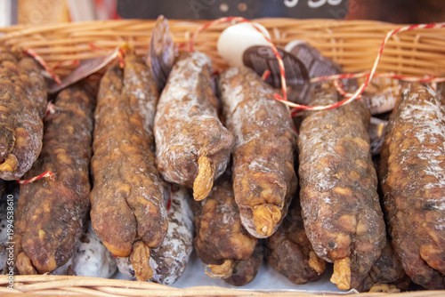 Close up of artisanal walnut saucissons secs at Sarlat morning market