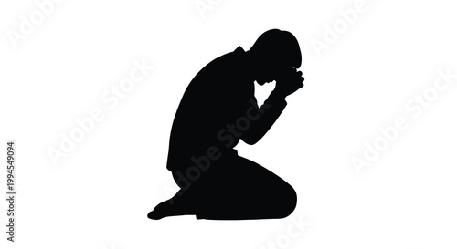 Silhouette of a person kneeling in a posture of prayer or contemplation