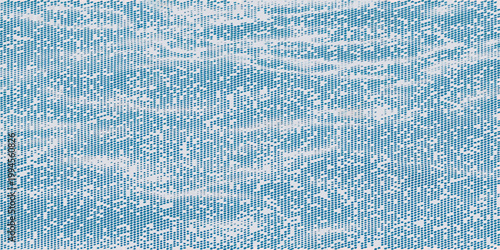 Abstract aerial view of rippling turquoise water and white foam