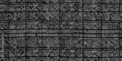 Intricate black and white geometric pattern resembling woven textile art