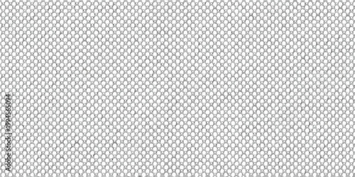 Close up of a tightly woven monochromatic textile with a dotted pattern