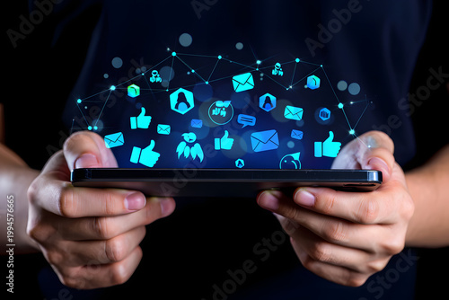 Digital Connectivity: A person holds a smartphone, illuminating a network of social media icons, symbolizing the interconnectedness of modern digital communication.