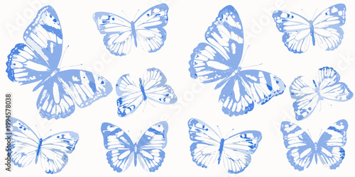 A collection of delicate blue butterflies arranged on a white background