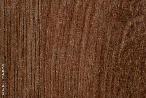 Close-up of dark brown wood grain texture, HPL laminate surface with vertical timber pattern, professional furniture finish background for interior design and architectural visualization.