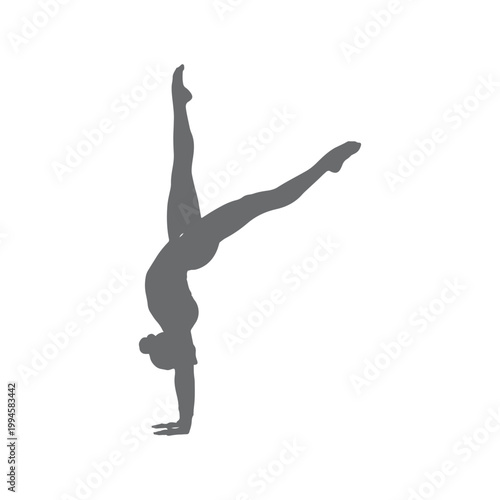 Shadows of a girl, a gymnast in a handstand pose against a white backdrop
