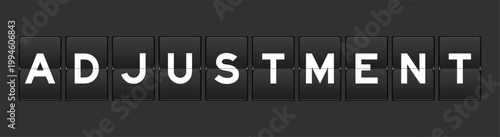 Black color analog flip board with word adjustment on gray background