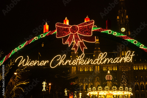 Photography Wiener Christkindlmarkt neon sign with festive red bow