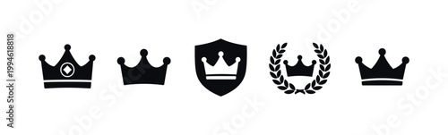 Set of black crown emblem icons with shield and laurel wreath in minimalist silhouette style, showing royal symbols for heraldic design use
