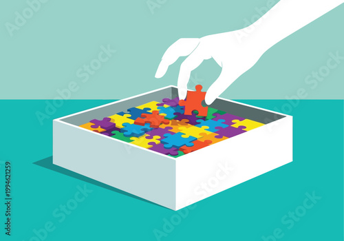Hand placing a red puzzle piece into a box filled with colorful jigsaw pieces, concept of problem solving and finding the right solution