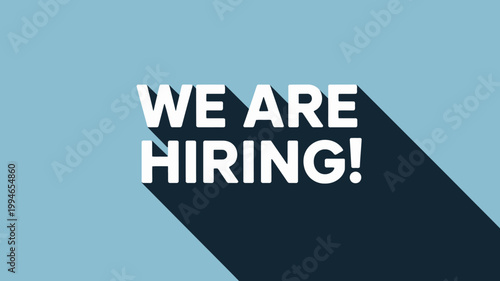 A simple graphic displays the phrase we are hiring in bold white lettering cast with a dramatic shadow on a light blue background high quality professional