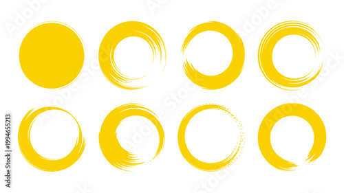 A collection of vibrant yellow circular brushstroke elements arranged in a grid showcasing varying degrees of completeness and texture high quality professional detailed modern elegant stylish