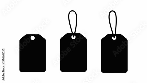 Bild auf Leinwand A minimalist depiction of three black tags each featuring a hole for attachment