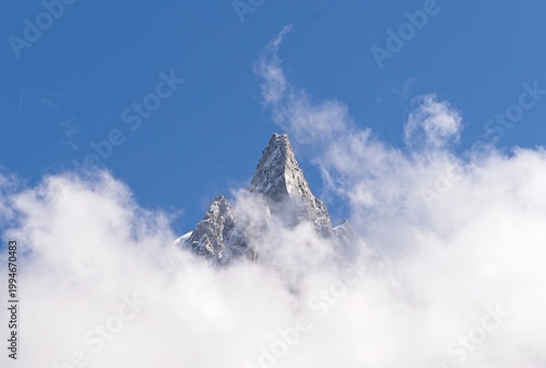 Mountain Peak Above Clouds – Alpine Landscape with Blue Sky