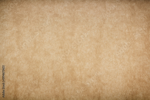 Aged parchment paper texture background for vintage designs and layouts