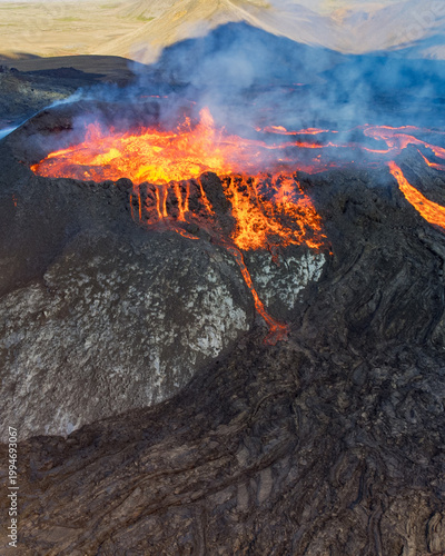 Bilde på lerret Close aerial view of Icelandic volcanic eruption with incandescent lava streams, Instagram square format