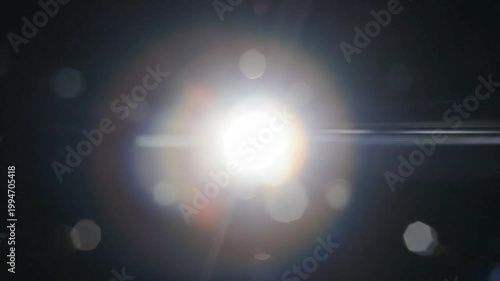 White Cinematic Lens Flare With Rainbow Reflection Overlay Video