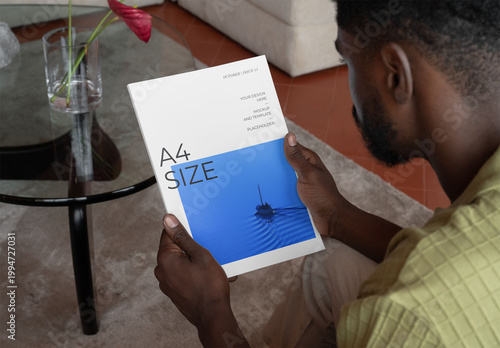 Mockup Of Man Holding Customizable A4 Magazine