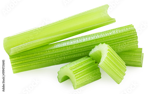 Celery ribs isolated on white. Fresh Celery stems with chopped celery pieces  closeup. Dieting food  vegetables