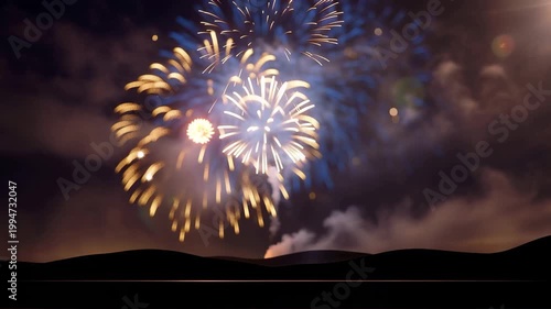 Glittering blue and gold fireworks bursting in festive celebration sky