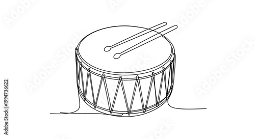Drum with drumsticks on top surface.