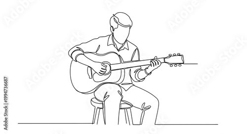 Man playing acoustic guitar sitting down.