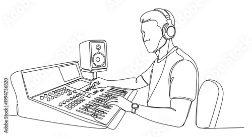 Man wearing headphones working on soundboard.
