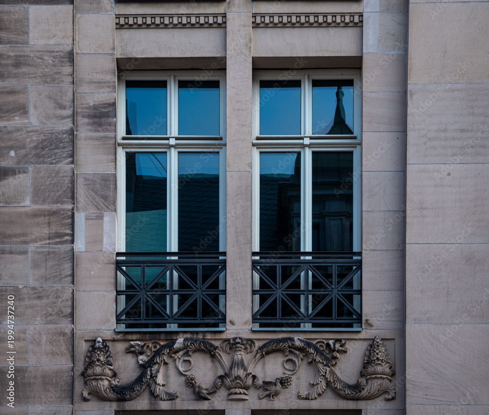 Fototapeta premium Classical window and stone ornament on the façade of the Staatsbibliothek Unter den Linden in Berlin