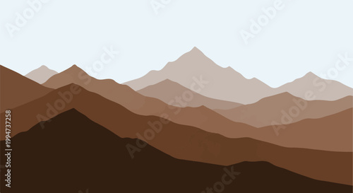 Layered brown mountain ranges stretch across a pale sky, creating a natural abstract panorama