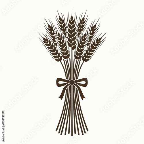 Brown wheat bundle with bow on cream background