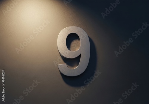 Metallic number nine on a dimly lit wall