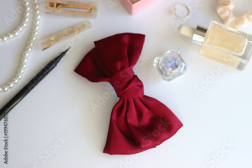 Various accessories and beauty products on white background. Coquette aesthetic. Selective focus.