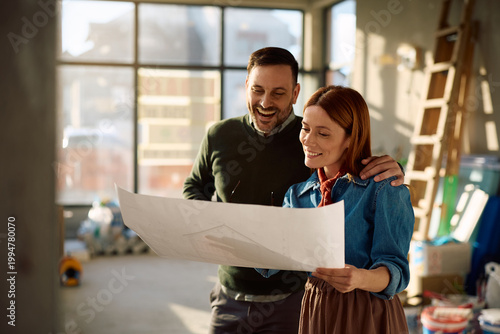 Canvastavla Happy new homeowners analyzing plans during house remodeling project
