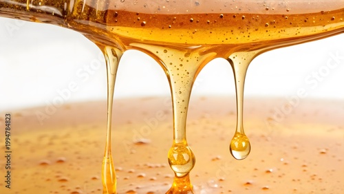 Golden honey dripping macro texture sweet liquid natural organic food close up