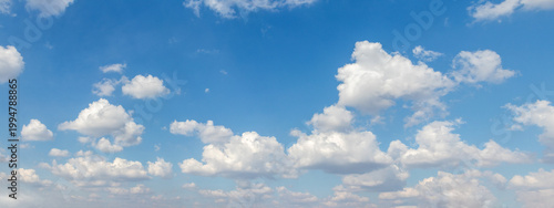 Canvas Print Bright blue daytime sky with fluffy white cumulus clouds — sunny summer day, per